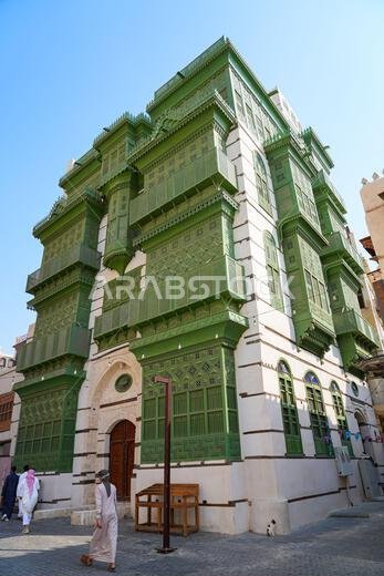 Traditional Hejazi building characterized by mashrabiya screens and wooden balconies in Al-Balad, the Old Town of Jeddah, Saudi Arabia