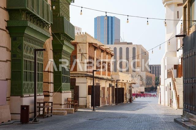 The historic Al Ma'amar Mosque and green Roshan balconies in Al Balad, the Old Town of Jeddah in Saudi Arabia