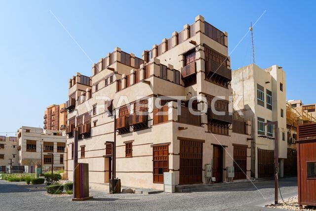 Traditional Hejazi building characterized by mashrabiya screens and wooden balconies in Al-Balad, the Old Town of Jeddah, Saudi Arabia