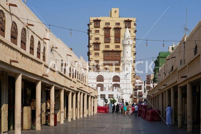 The historic Al Ma'amar Mosque and green Roshan balconies in Al Balad, the Old Town of Jeddah in Saudi Arabia