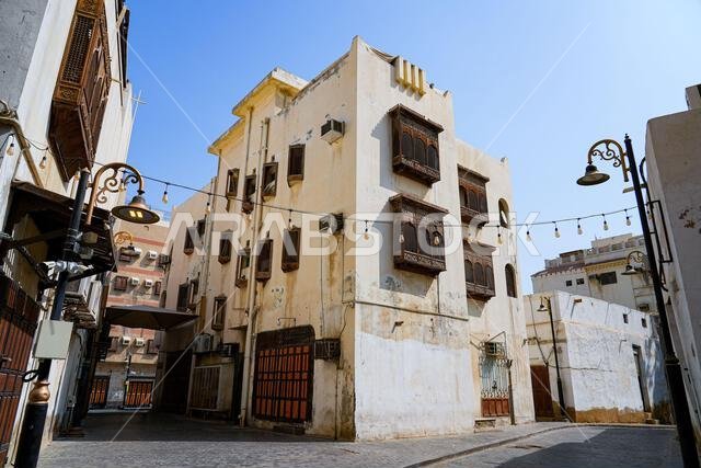 Traditional Hejazi building characterized by mashrabiya screens and wooden balconies in Al-Balad, the Old Town of Jeddah, Saudi Arabia
