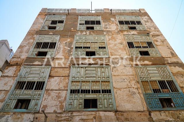 Traditional Hejazi building characterized by mashrabiya screens and wooden balconies in Al-Balad, the Old Town of Jeddah, Saudi Arabia