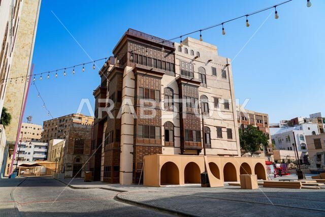 Traditional Hejazi building characterized by mashrabiya screens and wooden balconies in Al-Balad, the Old Town of Jeddah, Saudi Arabia