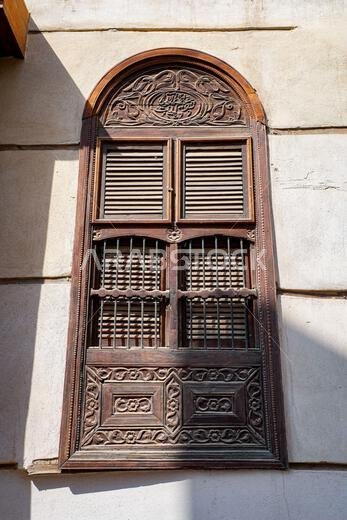 Traditional carved wooden window with Arabic calligraphy in Al-Balad, the Old Town of Jeddah, Saudi Arabia