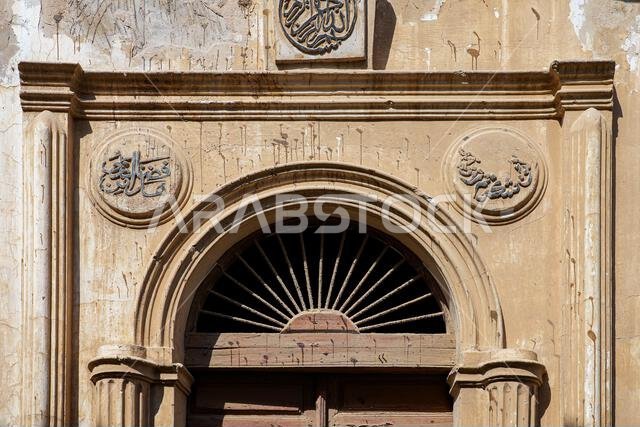 Traditional ornate stone doorway with Arabic calligraphy in Al-Balad, the Old Town of Jeddah, Saudi Arabia