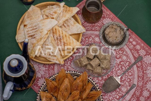 Oriental sweets and coffee on the table. Baklava, halva for dessert. Food and drink. Oriental sweets and coffee on the table. Baklava, halva for dessert. Food and drink.