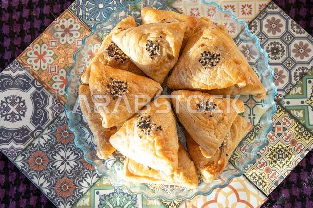 Traditional Muslim pies. Pastry from dough. Food in a bowl on the table top view