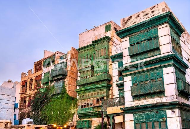Traditional architecture with green wooden balconies in the Al Balad historic district of Jeddah, Saudi Arabia. Traditional architecture with green wooden balconies in the Al Balad historic district of Jeddah, Saudi Arabia.
