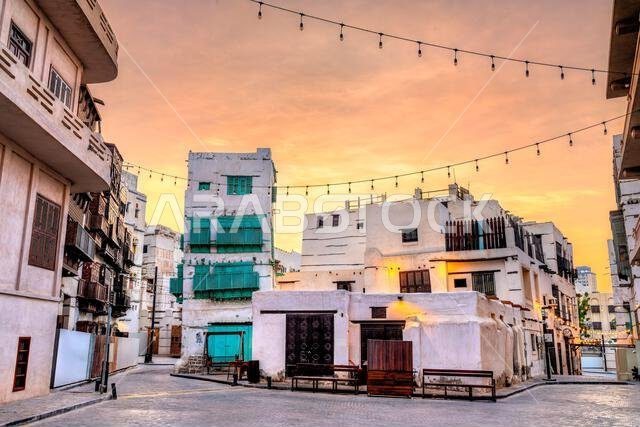 Traditional architecture and historic buildings in the Al-Balad district of Jeddah, Saudi Arabia, during sunset.