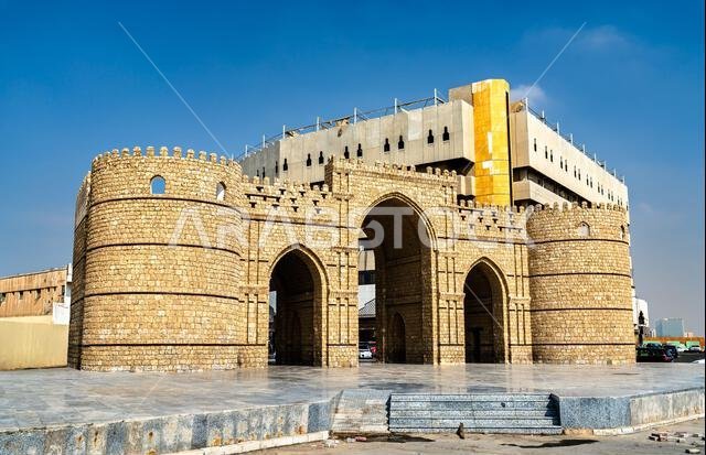 View of Bab Makkah, the historic stone gateway to the Al-Balad district in Jeddah, Saudi Arabia, featuring traditional arches and bastions. View of Bab Makkah, the historic stone gateway to the Al-Balad district in Jeddah, Saudi Arabia, featuring traditional arches and bastions.