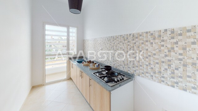 صورة لمطبخ في شقة سكنية بتصاميم عصرية و جذابة ، ديكورات داخلية رائعة ، ديكور منزلي راقي ، تصاميم فخمة و جميلة ، شقق سكنية سياحية ، أوتيل ، فنادق فاخرة
