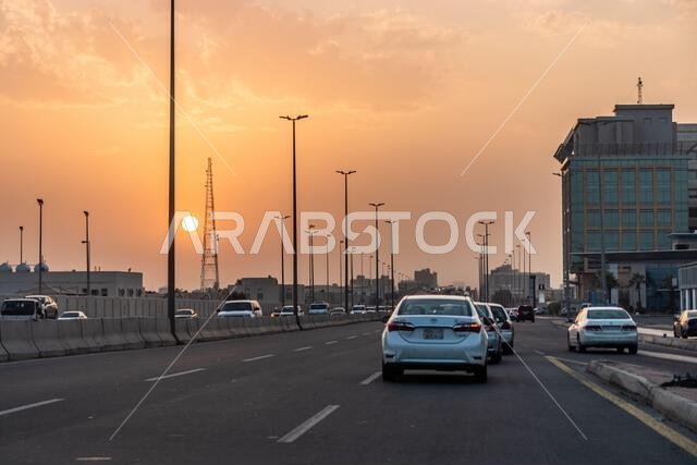 JEDDAH, SAUDI ARABIA - NOVEMBER 14, 2021: Sunset over a highway in Jeddah, Saudi Arabia JEDDAH, SAUDI ARABIA - NOVEMBER 14, 2021: Sunset over a highway in Jeddah, Saudi Arabia