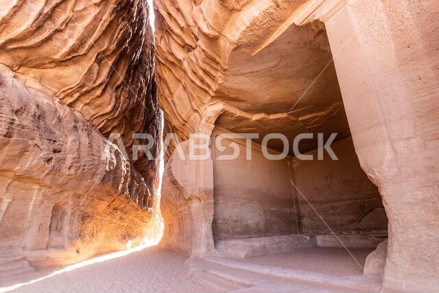 Narrow pasage through Jabal Ithlib mountain, the Siq, next to The Diwan, rock-cut chamber, at Hegra (Mada'in Salih) site near Al Ula, Saudi Arabia