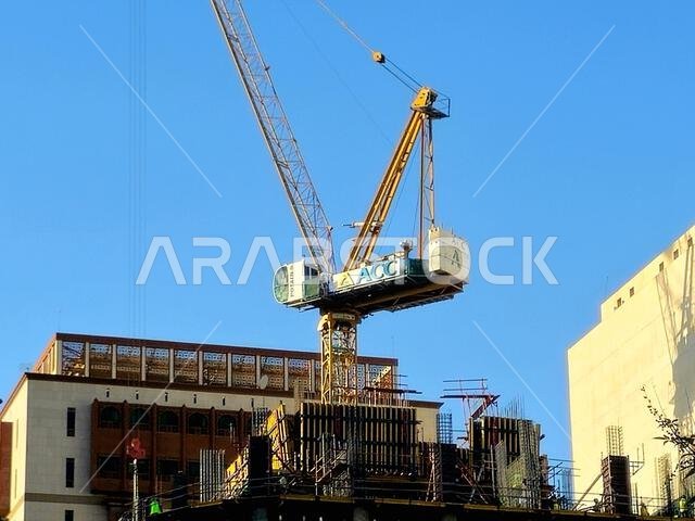Medina, Saudi Arabia, June 26 2024: a new high building in Madinah city that is under construction, with a crane tower of ACC Arabian Construction Com