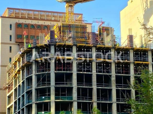 Medina, Saudi Arabia, June 26 2024: a new high building in Madinah city that is under construction, with a crane tower of ACC Arabian Construction Com