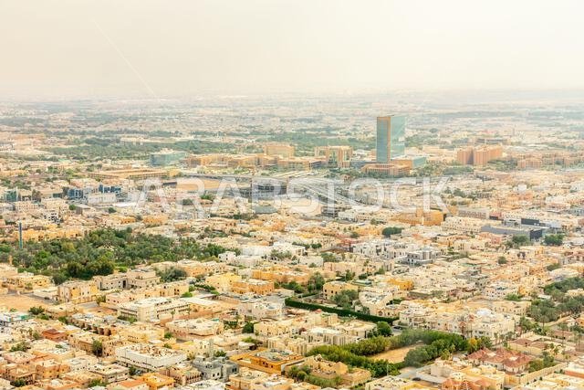 Aerial panorama of residential areas of Riyadh city with tv tower in the background, Al Riyadh, Saudi Arabia