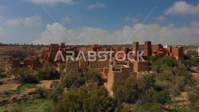 Aerial view of red stone and mud houses with slates in a village, Asir province, Sarat Abidah, Saudi Arabia