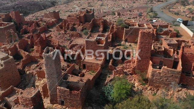 Aerial view of red stone and mud houses with slates in a village, Asir province, Sarat Abidah, Saudi Arabia