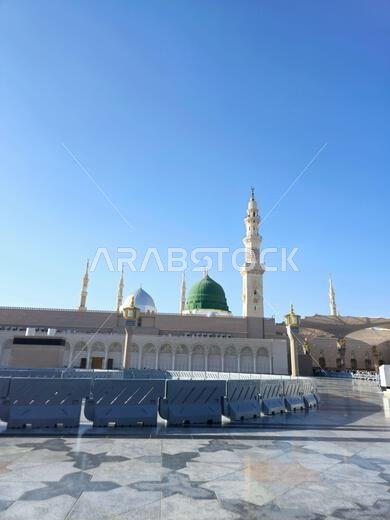 Medina, Saudi Arabia, June 26 2024: The Minaret and the Green dome of The Prophet's Mosque or Al Masjid Al Nabawi in Madinah, a major site of pilgrima Medina, Saudi Arabia, June 26 2024: The Minaret and the Green dome of The Prophet's Mosque or Al Masjid Al Nabawi in Madinah, a major site of pilgrima