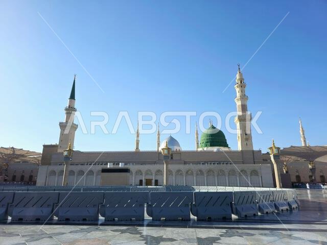 Medina, Saudi Arabia, June 26 2024: The Minaret and the Green dome of The Prophet's Mosque or Al Masjid Al Nabawi in Madinah, a major site of pilgrima