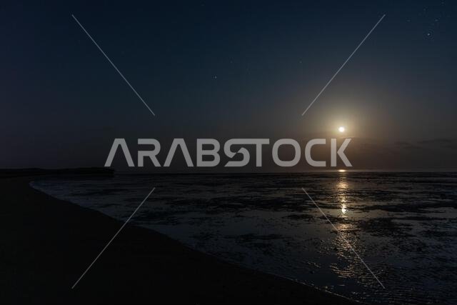 Moon shining over a coast of Farasan island, Saudi Arabia