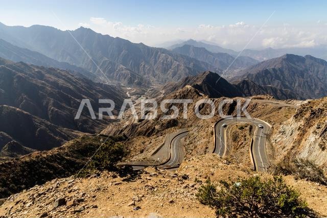 View of Al Souda mountains with a winding road near Abha, Saudi Arabia View of Al Souda mountains with a winding road near Abha, Saudi Arabia