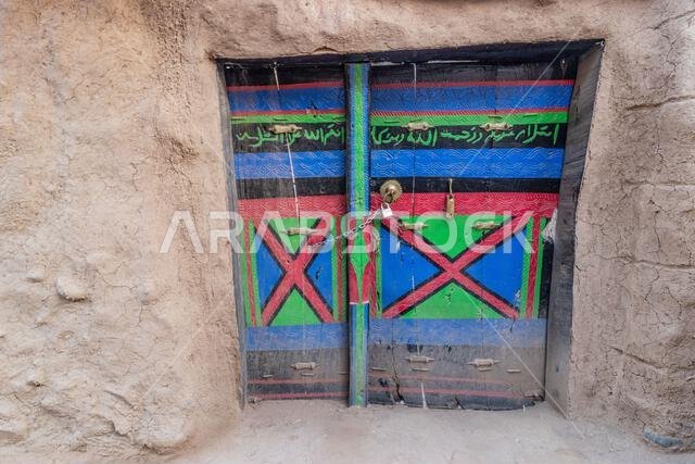 Door of an old mud-brick house in Dhahran al Janub, Saudi Arabia