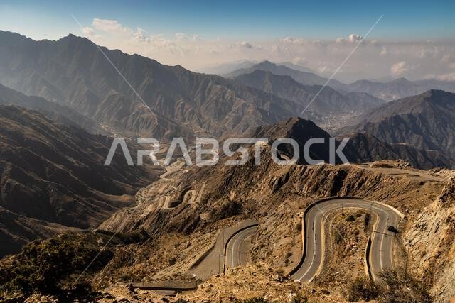 View of Wadi Hali in Al Souda mountains with a winding road near Abha, Saudi Arabia