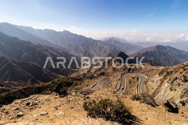 View of Al Souda mountains with a winding road near Abha, Saudi Arabia View of Al Souda mountains with a winding road near Abha, Saudi Arabia