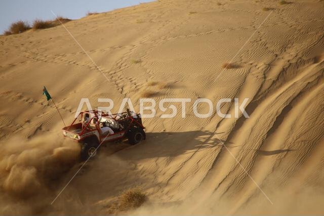 Nawan , Saudi Arabia  Jan 7 2023: 4x4 cars drift across Saudi Arabia’s striking sand desert. The vehicles perform thrilling maneuvers, on sand dunes