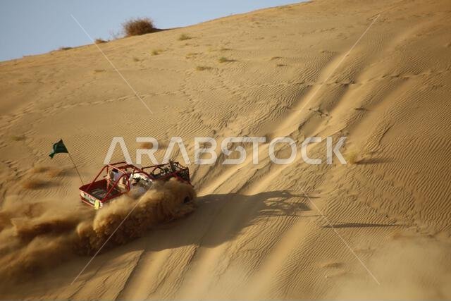 Nawan , Saudi Arabia  Jan 7 2023: 4x4 cars drift across Saudi Arabia’s striking sand desert. The vehicles perform thrilling maneuvers, on sand dunes