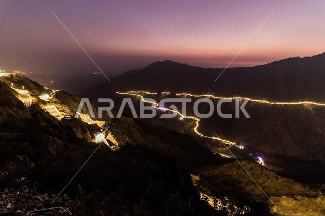 Evening view of a deep valley with King Fahd Road in Sarawat mountains near Al Baha, Saudi Arabia Evening view of a deep valley with King Fahd Road in Sarawat mountains near Al Baha, Saudi Arabia