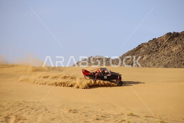 Nawan , Saudi Arabia Jan 7 2023: 4x4 cars drift across Saudi Arabia’s striking sand desert. The vehicles perform thrilling maneuvers, on sand dunes Nawan , Saudi Arabia Jan 7 2023: 4x4 cars drift across Saudi Arabia’s striking sand desert. The vehicles perform thrilling maneuvers, on sand dunes