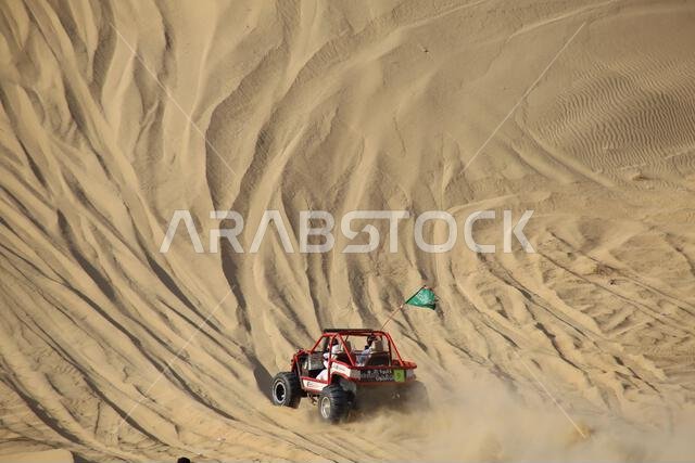 Nawan , Saudi Arabia Jan 7 2023: 4x4 cars drift across Saudi Arabia’s striking sand desert. The vehicles perform thrilling maneuvers, on sand dunes Nawan , Saudi Arabia Jan 7 2023: 4x4 cars drift across Saudi Arabia’s striking sand desert. The vehicles perform thrilling maneuvers, on sand dunes