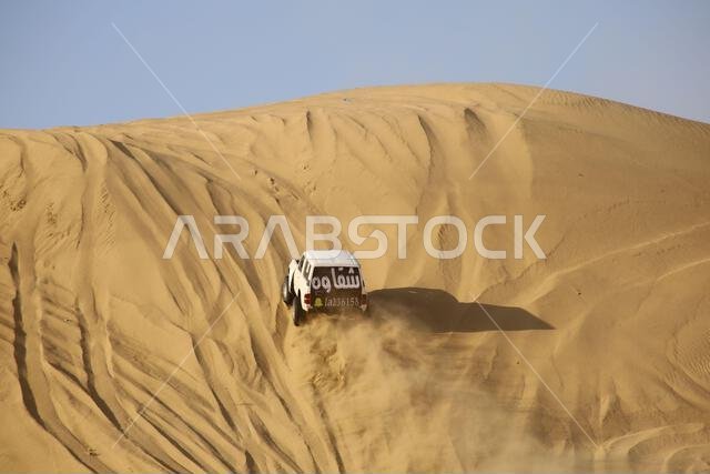 Nawan , Saudi Arabia  Jan 7 2023: 4x4 cars drift across Saudi Arabia’s striking sand desert. The vehicles perform thrilling maneuvers, on sand dunes