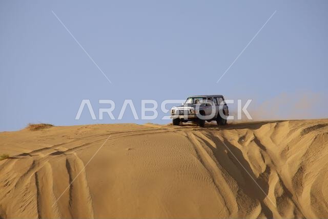 Nawan , Saudi Arabia  Jan 7 2023: 4x4 cars drift across Saudi Arabia’s striking sand desert. The vehicles perform thrilling maneuvers, on sand dunes