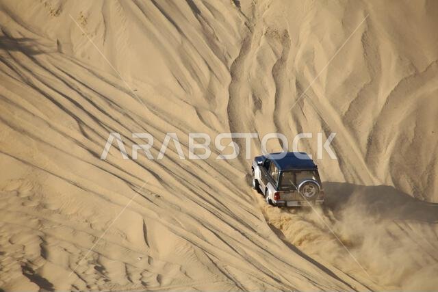 Nawan , Saudi Arabia  Jan 7 2023: 4x4 cars drift across Saudi Arabia’s striking sand desert. The vehicles perform thrilling maneuvers, on sand dunes