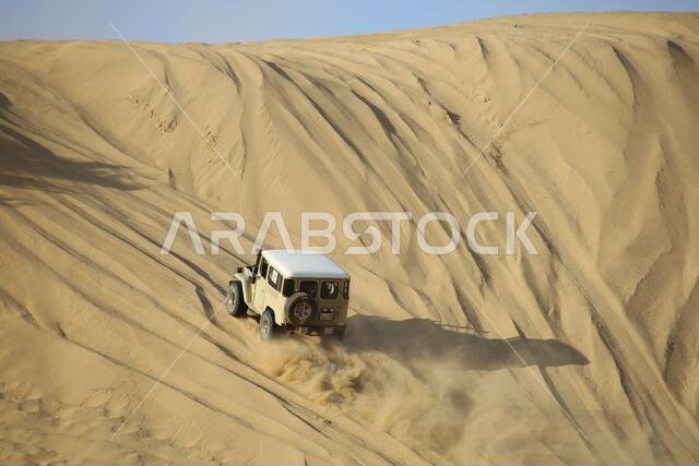 Nawan , Saudi Arabia  Jan 7 2023: 4x4 cars drift across Saudi Arabia’s striking sand desert. The vehicles perform thrilling maneuvers, on sand dunes
