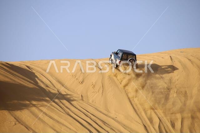 Nawan , Saudi Arabia  Jan 7 2023: 4x4 cars drift across Saudi Arabia’s striking sand desert. The vehicles perform thrilling maneuvers, on sand dunes