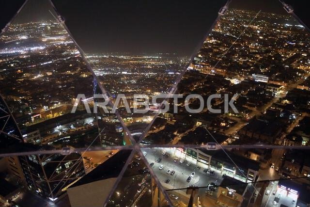 Riyadh, Saudi Arabia – September 11, 2024: The Saudi capital Riyadh at night, reflected in the globe of Al-Faisaliah Tower
