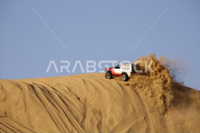 Nawan , Saudi Arabia  Jan 7 2023: 4x4 cars drift across Saudi Arabia’s striking sand desert. The vehicles perform thrilling maneuvers, on sand dunes