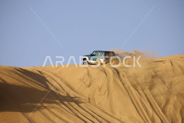 Nawan , Saudi Arabia  Jan 7 2023: 4x4 cars drift across Saudi Arabia’s striking sand desert. The vehicles perform thrilling maneuvers, on sand dunes
