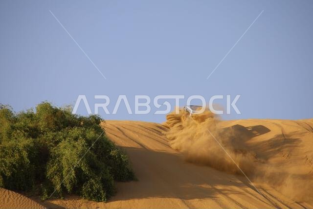 Nawan , Saudi Arabia  Jan 7 2023: 4x4 cars drift across Saudi Arabia’s striking sand desert. The vehicles perform thrilling maneuvers, on sand dunes