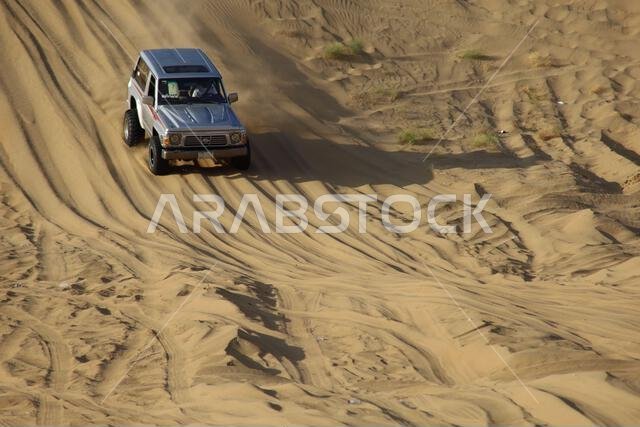 Nawan , Saudi Arabia  Jan 7 2023: 4x4 cars drift across Saudi Arabia’s striking sand desert. The vehicles perform thrilling maneuvers, on sand dunes