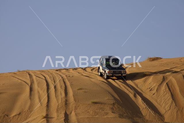 Nawan , Saudi Arabia  Jan 7 2023: 4x4 cars drift across Saudi Arabia’s striking sand desert. The vehicles perform thrilling maneuvers, on sand dunes