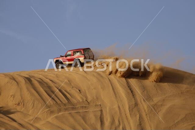 Nawan , Saudi Arabia  Jan 7 2023: 4x4 cars drift across Saudi Arabia’s striking sand desert. The vehicles perform thrilling maneuvers, on sand dunes