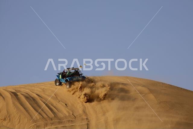 Nawan , Saudi Arabia  Jan 7 2023: 4x4 cars drift across Saudi Arabia’s striking sand desert. The vehicles perform thrilling maneuvers, on sand dunes