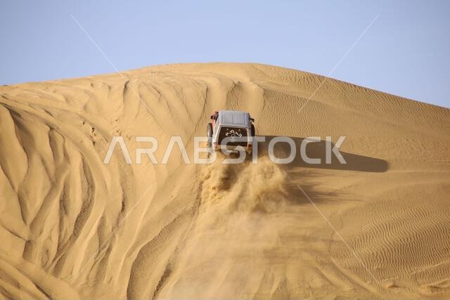 Nawan , Saudi Arabia  Jan 7 2023: 4x4 cars drift across Saudi Arabia’s striking sand desert. The vehicles perform thrilling maneuvers, on sand dunes