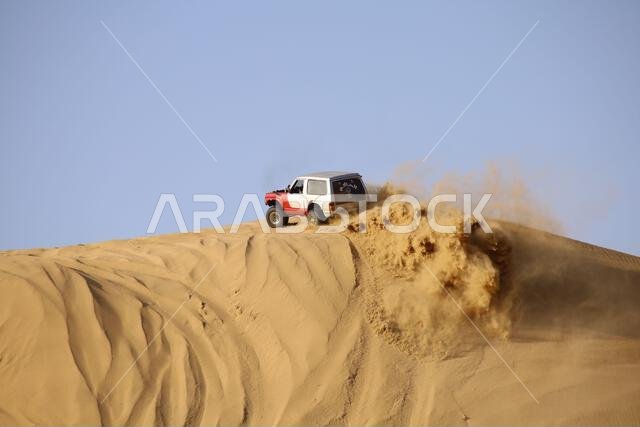 Nawan , Saudi Arabia  Jan 7 2023: 4x4 cars drift across Saudi Arabia’s striking sand desert. The vehicles perform thrilling maneuvers, on sand dunes