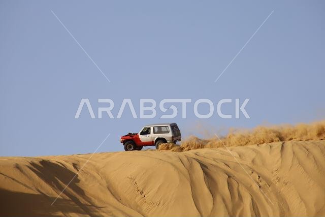 Nawan , Saudi Arabia  Jan 7 2023: 4x4 cars drift across Saudi Arabia’s striking sand desert. The vehicles perform thrilling maneuvers, on sand dunes